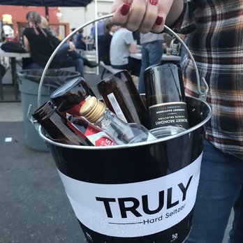 The Little Longhorn Saloon - Emptying bottles and buying refills - Dive Bars Near Me - Austin, Texas