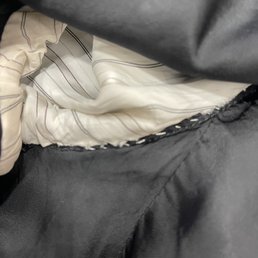 They ripped the entire lining out and then stitched it back with white thread.