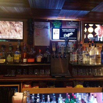 The Hut - a bar with a lot of bottles of alcohol - Bars Near Me - Ojai, California