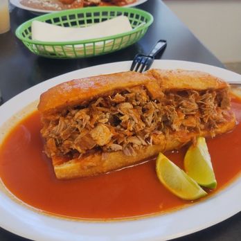 Rinkon Guadalajara - Torta Ahogada in liquid sauce with Carnitas and maybe canned beans . - Mexican Near Me - Hawthorne, California Rinkon Guadalajara - Torta Ahogada in liquid sauce with Carnitas and maybe canned beans . - Mexican Near Me - Hawthorne, California