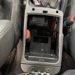 Lithia Chrysler Dodge Jeep Ram FIAT of Eugene - Seatbelt trapped in middle console (pic is after removing one part of the console to find it).