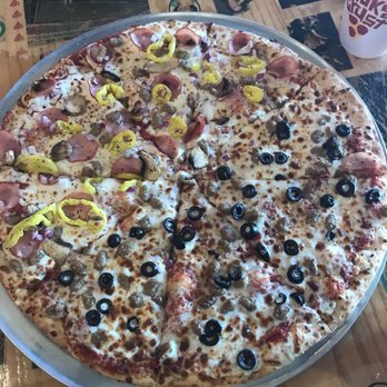 Crooked Crust Pizza - Half sausage black olive half Canadian bacon sausage mushroom red onion and banana pepper - Pizza Near Me - Denton, Texas Crooked Crust Pizza - Half sausage black olive half Canadian bacon sausage mushroom red onion and banana pepper - Pizza Near Me - Denton, Texas