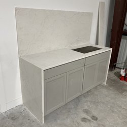 D and W SRQ - Local wholesale granite suppliers warehouse display of Vadera Quartz in the works.