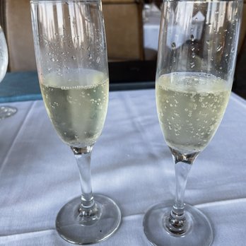 Lighthouse Sound - two glasses of wine on a table - New American Near Me - Bishopville, Maryland