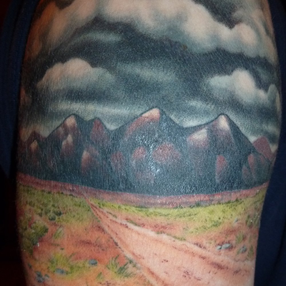 Good Faith Tattoos - Amazing desert landscape done by Ian at Good Faith Tattoos. This is a cover up, and you would never know the old tattoo existed! - Tattoo Near Me - Boston, Massachusetts