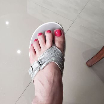 Super Nails - My left foot! The other foot under the solar light. The polish is OPI Strawberry Margarita which I brought in. - Nail Salons Near Me - Katy, Texas