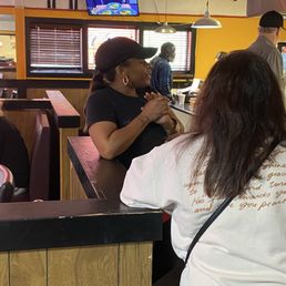 Crystal explaining everything to some new customers Crystal explaining everything to some new customers
