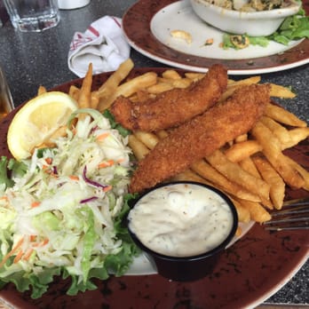 Ray's Waterfront - Fish and chips halibut. Compare the size of the fish to the fries and you will get an idea of how small the portions are. - Seafood Near Me - Seward, Alaska Ray's Waterfront - Fish and chips halibut. Compare the size of the fish to the fries and you will get an idea of how small the portions are. - Seafood Near Me - Seward, Alaska