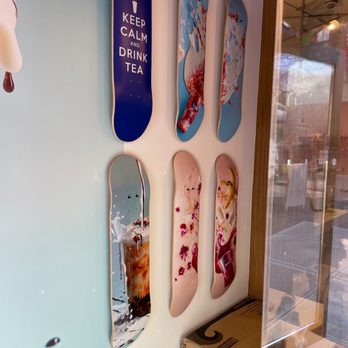 Teazzi Tea Shop - a variety of skateboards mounted on a wall - Bubble Tea Near Me - Flushing, New York