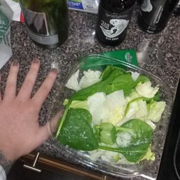 a person's hand on a counter top