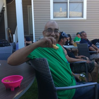 Kelly's Tavern - Bear enjoying blues blues in the patio - Pubs Near Me - Chicago, Illinois