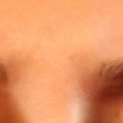 Missing patch of hair, uneven, and it doesn't even look like a professional did my eyebrows.