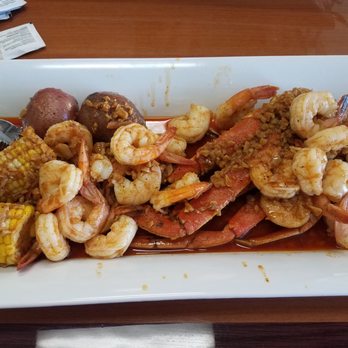 Cajun Deli - 1 lb. peeled shrimp 1 cluster crab legs, medium spice house seasoning - Cajun/Creole Near Me - Brooklyn Park, Minnesota
