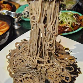 Pocha 55 - 들기름 막국수 Cold Sesame Buckwheat Noodles 15.99 -   Perfectly toothsome soba style noodles with a rich toasted sesame oil sauce, the egg yolk - Bars Near Me - Duluth, Georgia