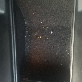 Flagship Carwash - How they "vacuum" your vehicle at Dr. Wash. Middle console with crumbs everywhere - Car Wash Near Me - Chantilly, Virginia