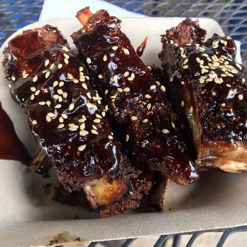 Côte-Rôtie - a plate of ribs covered in bbq sauce - Food Trucks Near Me