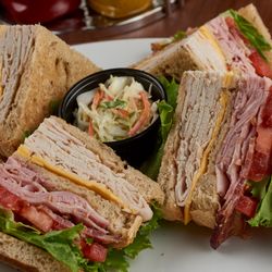 Myron's Delicatessen & Cafe - Club Sandwich. Myron's Delicatessen® doles out an extra helping of New York culture complete with humor, artwork, and music a...