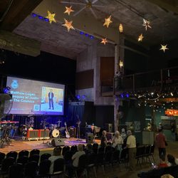 Acorn Theater - From the back row: View of the stage, the bar and bathrooms to the far right. There is no bad seat here!