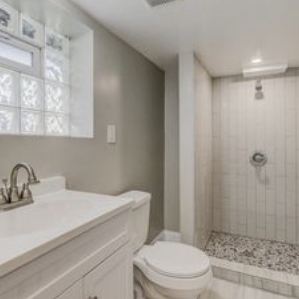 Monumental Contractors - Basement bathroom with sewage ejector pump - General Contractors Near Me Monumental Contractors - Basement bathroom with sewage ejector pump - General Contractors Near Me