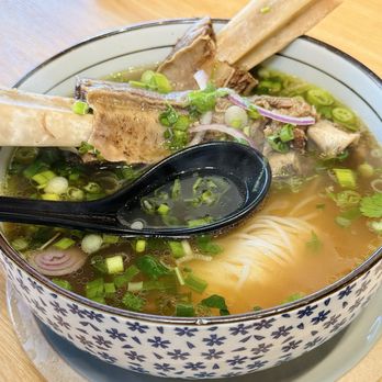NAM Kitchen - Lomita - MUST ORDER PHỞ SHORT RIB Four-hour braised premium short rib served with rich pho broth. - Asian Fusion Near Me - Lomita, California NAM Kitchen - Lomita - MUST ORDER PHỞ SHORT RIB Four-hour braised premium short rib served with rich pho broth. - Asian Fusion Near Me - Lomita, California