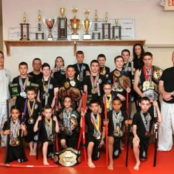 Demko Family Martial Arts & Fitness - A photo of kids competition team and various medals they have won over the past year.