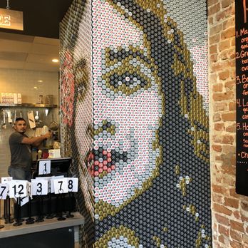 Slice - Such a cool bottle top artwork at the front of the restaurant. - Pizza Near Me - Laguna Beach, California