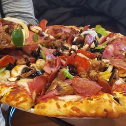 Serving up a slice of Contest Combo pizza. Serving up a slice of Contest Combo pizza.