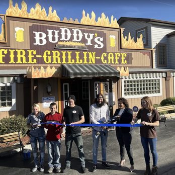 buddys cafe - a group of people cutting a ribbon - Cafes Near Me - Youngstown, Ohio