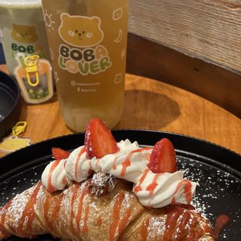 Boba Lover - Strawberry and Cream Croissant. Medium Matcha Latte with tapioca boba and a large Lychee Green Tea. - Bubble Tea Near Me - Gonzales, Louisiana Boba Lover - Strawberry and Cream Croissant. Medium Matcha Latte with tapioca boba and a large Lychee Green Tea. - Bubble Tea Near Me - Gonzales, Louisiana
