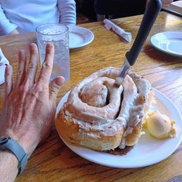 Cinnamon Roll in comparison to my hand