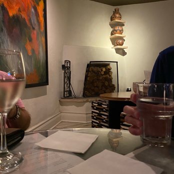 Ortiz Restaurant - a man holding a glass of wine - Bakeries Near Me - Santa Fe, New Mexico