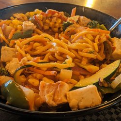 Put a lot of tofu in there. I think I might need the Sriracha sauce. I can't even taste the sweet & sour sauce.