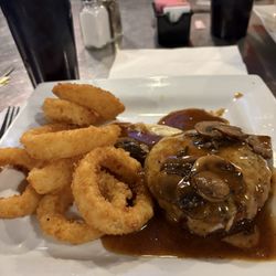 The Steel Bar & Grill - Mushroom Swiss burger no bun with a side of onion rings