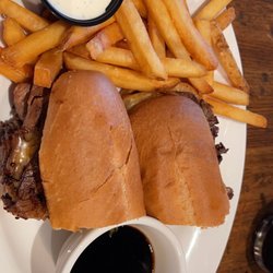 Patton Block Grill & Brew Pub - Prime rib sandwich with a side of fries