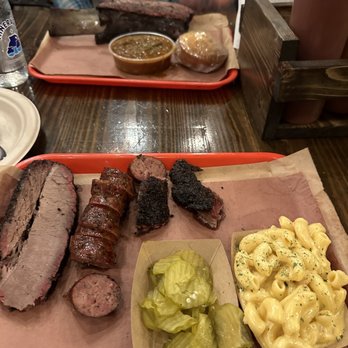 Terry Black's Barbecue - Brisket, sausage, burnt ends and a beef rib in the background - Barbeque Near Me - Austin, Texas Terry Black's Barbecue - Brisket, sausage, burnt ends and a beef rib in the background - Barbeque Near Me - Austin, Texas
