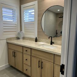 Toronto Handyman - Full bathroom remodel with custom vanity, countertop, mirror, lighting, and tile work.