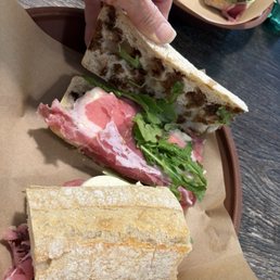 Napoletano Sandwich $18.25 prosciutto, fresh mozzarella, extra virgin olive oil, balsamic vinegar, fresh arugula on baguette. Napoletano Sandwich $18.25 prosciutto, fresh mozzarella, extra virgin olive oil, balsamic vinegar, fresh arugula on baguette.