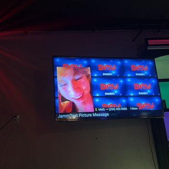 Austin's on the Avenue - a woman on a television screen - Dance Clubs Near Me - Waco, Texas