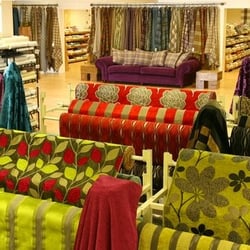 Cotton Print Factory Shop - ..... a small snapshot of our store depicting wallpapers and tartans in the background.