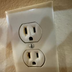 West Side Electric - Flames shot out of this outlet after the electrician forced the circuit back on.