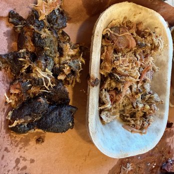 The Smoke Pit - This is the tray of pulled pork we received and all of the black beside of it was burnt skin and fat. They call this the bark of the pork. - American Near Me - Mooresville, North Carolina The Smoke Pit - This is the tray of pulled pork we received and all of the black beside of it was burnt skin and fat. They call this the bark of the pork. - American Near Me - Mooresville, North Carolina