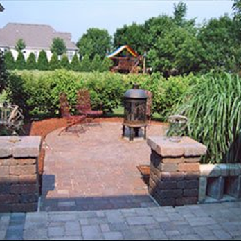 American Tree and Turf - a brick patio with a fire pit - Tree Services Near Me - Elburn, Illinois American Tree and Turf - a brick patio with a fire pit - Tree Services Near Me - Elburn, Illinois