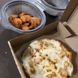 Pizza Hut - 10 boneless medium buffalo wings & a personal pizza with garlic parmesan sauce and chicken as the topping.