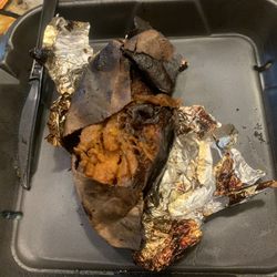 Sonny's BBQ - A burnt sweet potato. They allowed this to be sent in a to go order.