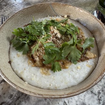 Nura - Pork vindaloo & coconut grits (goan-style curry, poached egg, breadcrumbs, herbs) - New American Near Me - Brooklyn, New York Nura - Pork vindaloo & coconut grits (goan-style curry, poached egg, breadcrumbs, herbs) - New American Near Me - Brooklyn, New York