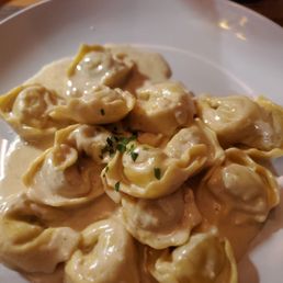 CHICKEN & PROSCIUTTO TORTELLINI Tortellini Filled with Chicken & Prosciutto, Served in a Black Truffle & Sage Cream Sauce