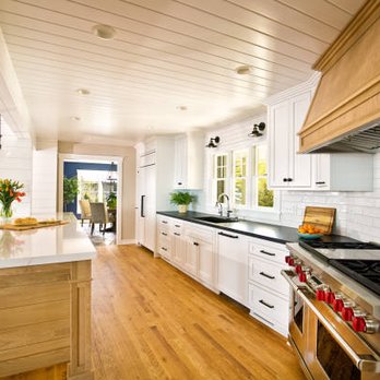 J&B Dyck Contracting - a kitchen with white cabinets and wood floors - Roofing Near Me J&B Dyck Contracting - a kitchen with white cabinets and wood floors - Roofing Near Me