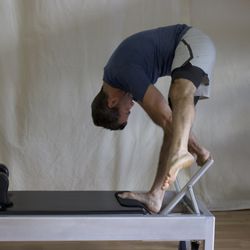 Vitality Method Studio - Tendon stretch on the classical Pilates reformer
