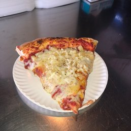 a slice of pizza on a paper plate