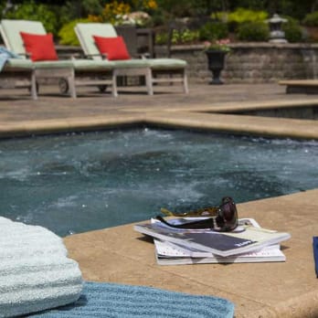 Promier Landscapes - a glass of orange juice next to a pool - Landscaping Near Me - Kingsport, Tennessee Promier Landscapes - a glass of orange juice next to a pool - Landscaping Near Me - Kingsport, Tennessee